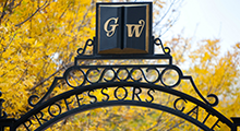 GW symbol on a campus gate overlooking campus
