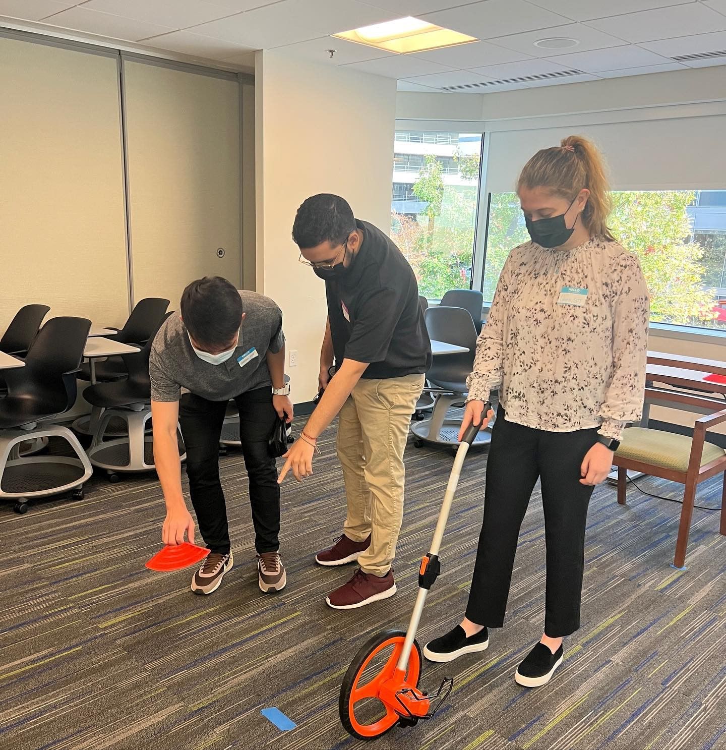 Three students set up for community mobility screens