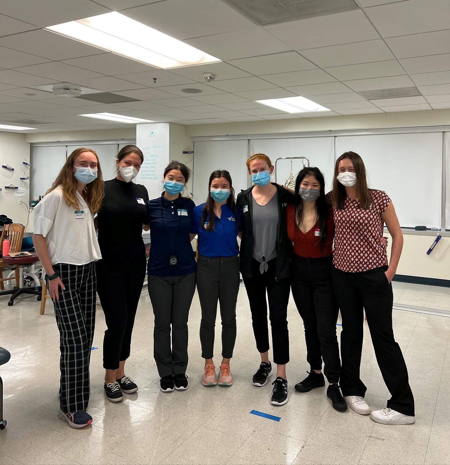 Seven students pose together during mobility screens