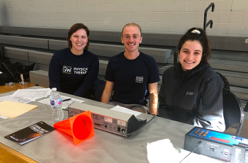 PT students sitting at a table
