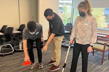 Three students set up for community mobility screens