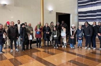 Group of students and community members posing for photo